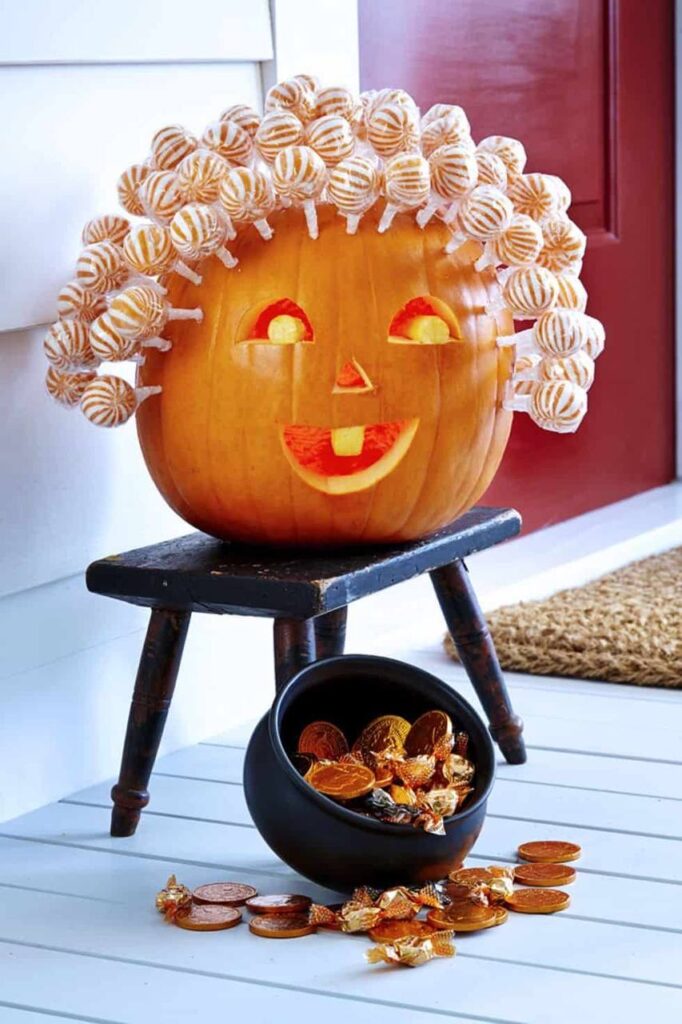 a pumpkin with candy on top of it