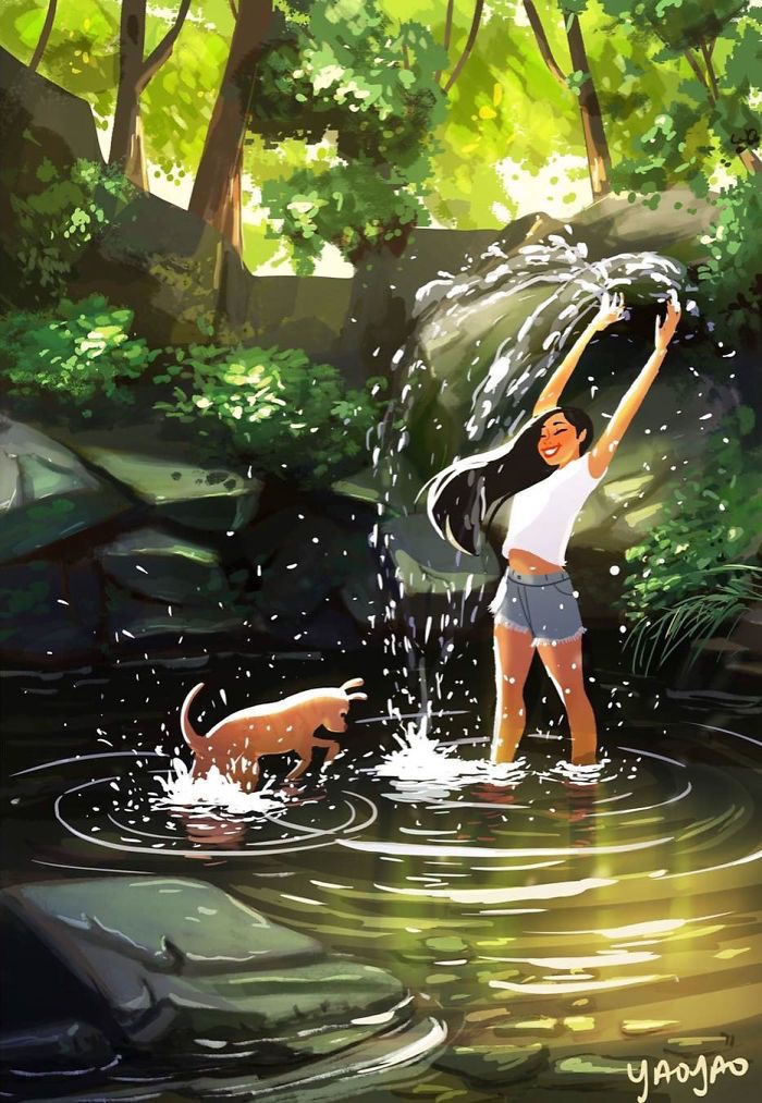 a woman playing with a dog in a pond