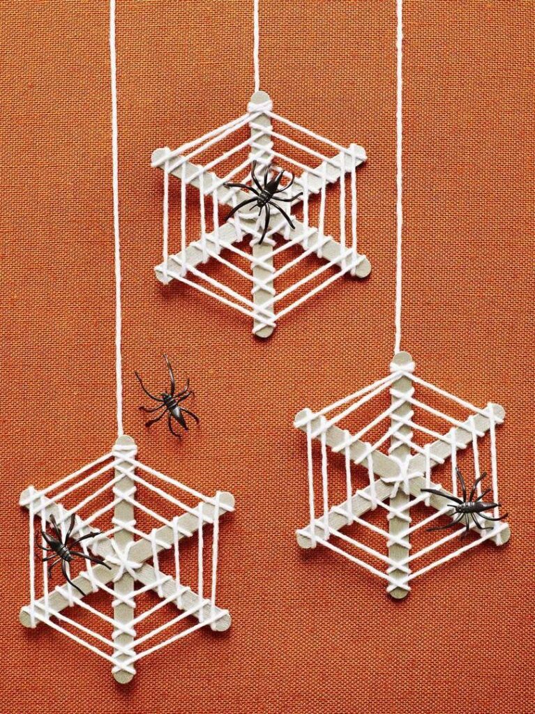 a group of spiders on a string