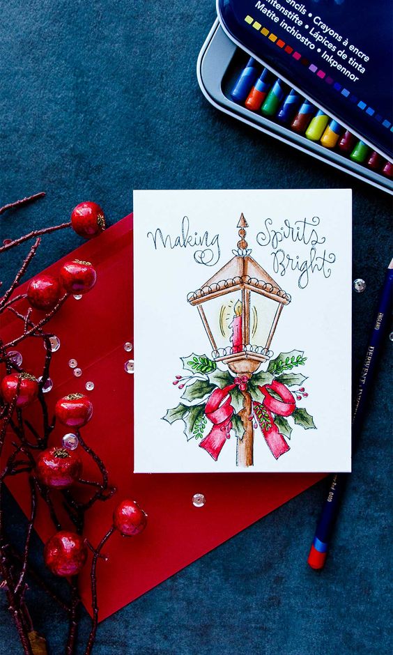 A christmas card with a lantern and red berries.