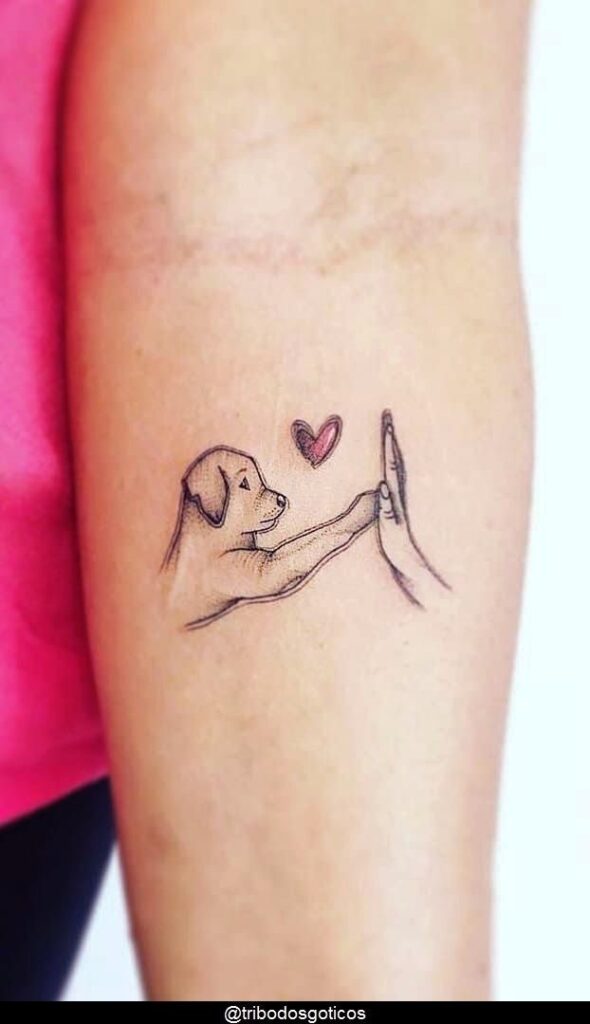 A tattoo of a dog with a heart on it.