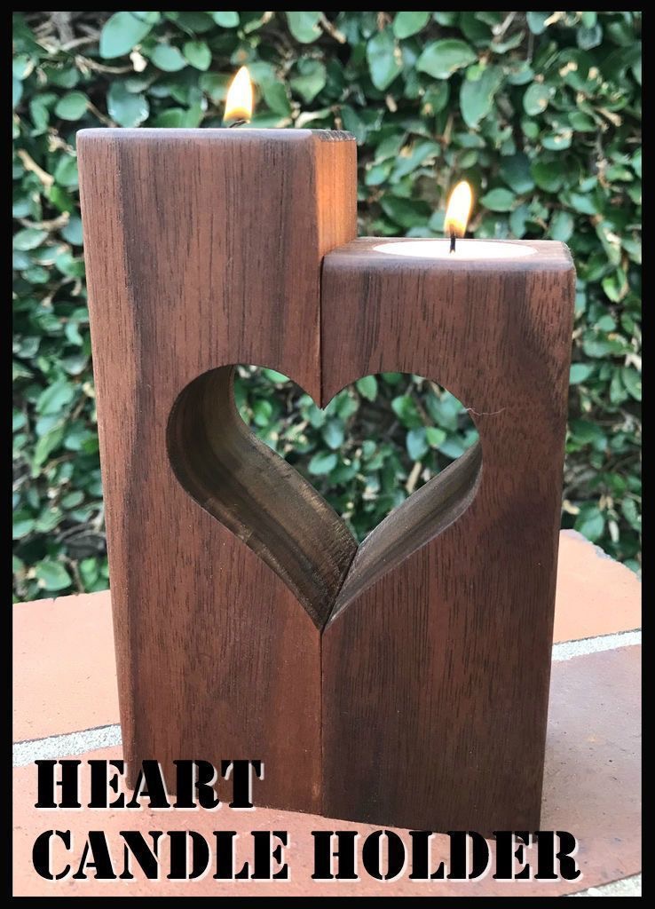 a candle holder with a heart cut out