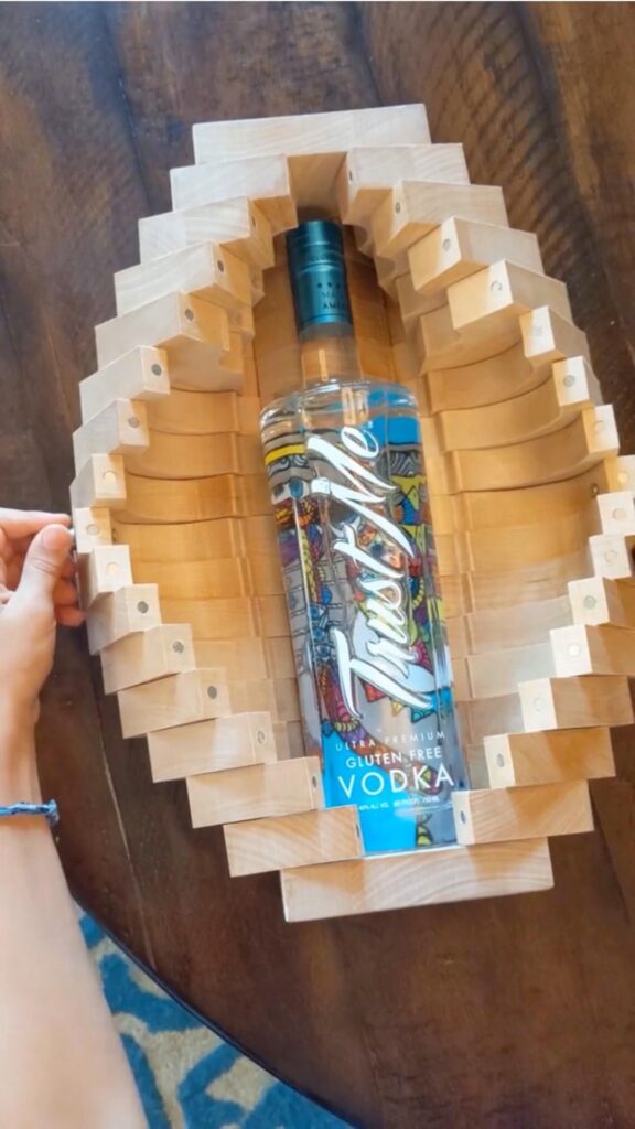 a bottle of vodka in a wooden box