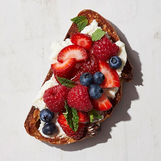 a piece of bread with fruit on top
