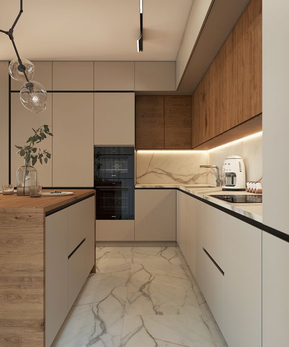 A modern kitchen with marble counter tops and wooden cabinets.