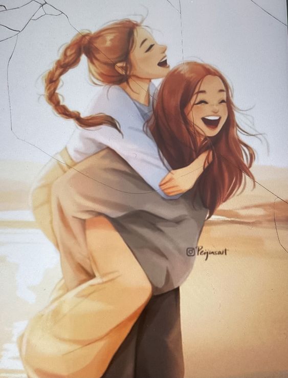Two girls hugging each other on the beach.
