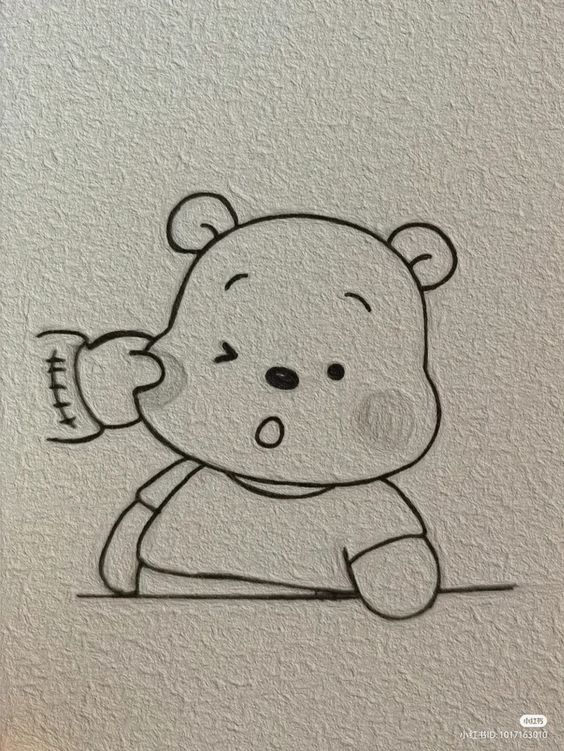A relief image of a cartoon bear with a neutral expression, holding a bottle, embossed on a textured paper surface.