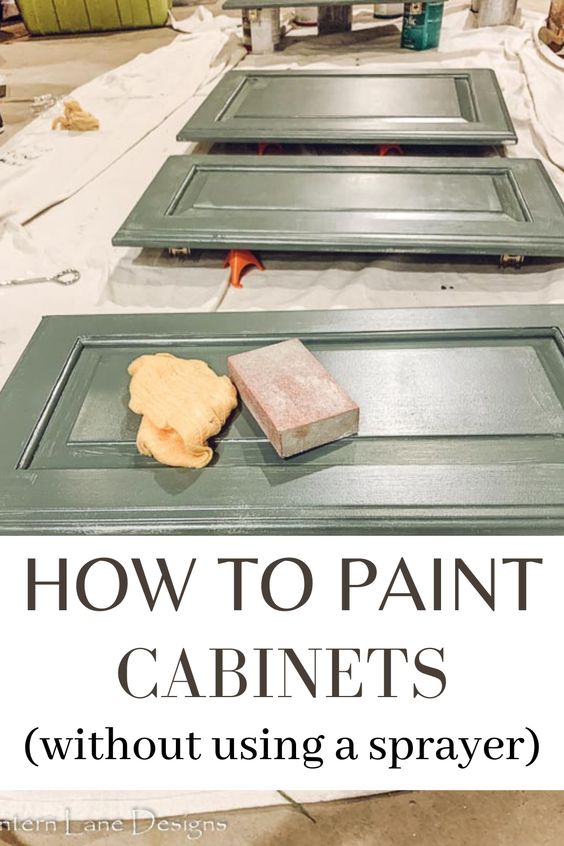 Green cabinet doors laid on a drop cloth with a sponge and sanding block, accompanied by the text "How to Paint Cabinets (without using a sprayer)".
