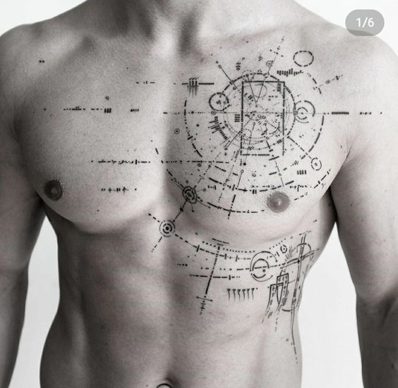 A person with a detailed, geometric tattoo spanning their chest and upper abdomen. The tattoo features intricate, tech-inspired designs and patterns.