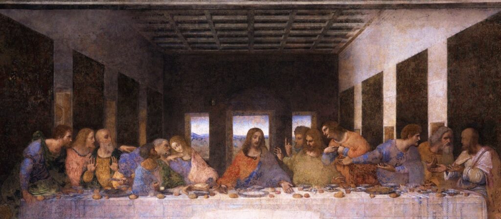 A painting of Jesus and his disciples seated at a long table, depicting the Last Supper by Leonardo da Vinci.