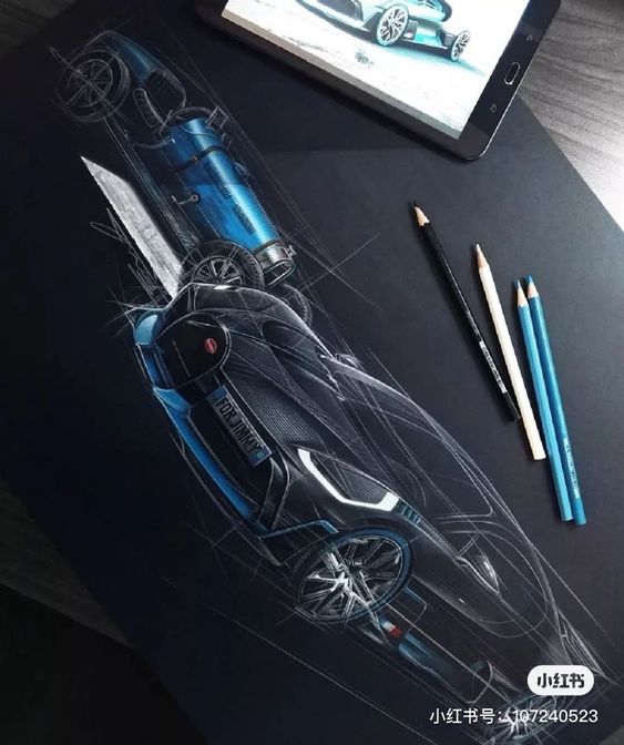 Car design sketch in blue with pencils and tablet on black surface, showcasing futuristic and classic car concepts.