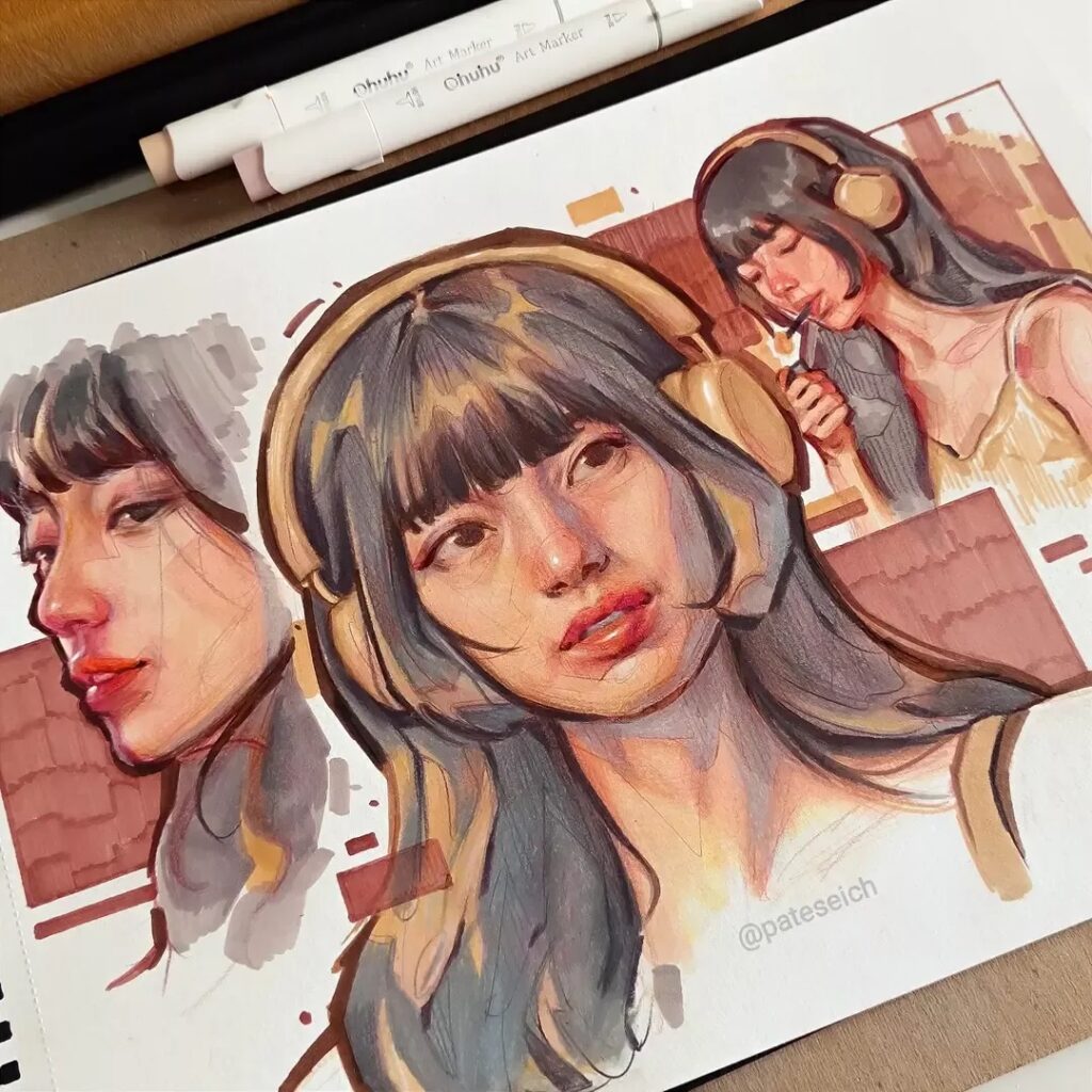A sketchbook page featuring multiple hand-drawn portraits of a woman in headphones. She is depicted in different angles and expressions, with muted colors. Markers and a pencil are placed on top.