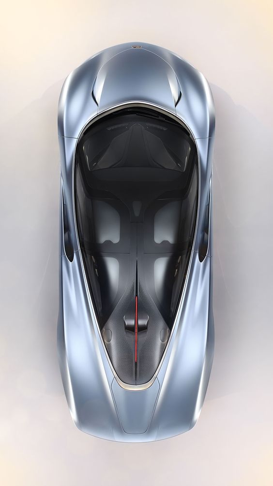 Top view of a sleek, silver sports car with aerodynamic design and tinted windows, highlighting its modern aesthetics.