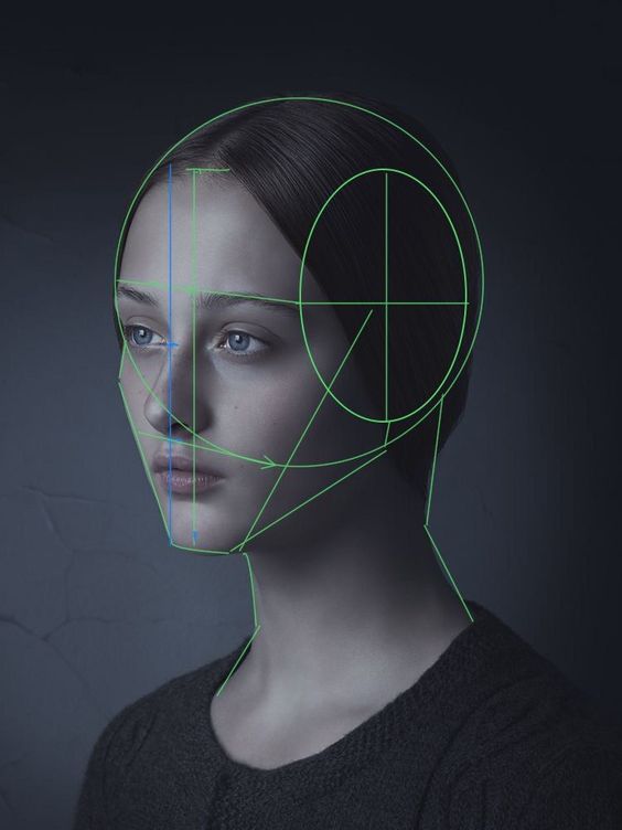 Woman's profile with facial recognition grid overlay against dark background.