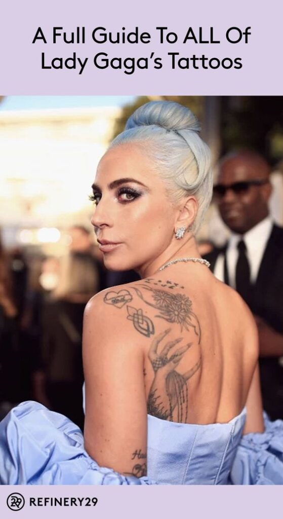 Lady Gaga showcases her tattoos in an elegant blue dress at a red carpet event; guide on her tattoos by Refinery29.
