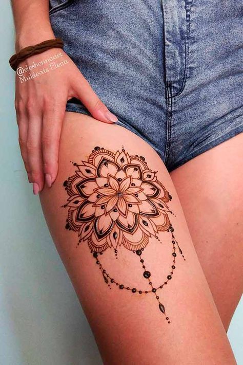 Intricate henna mandala design on upper thigh, adorned with denim shorts. Henna art by @deahennaart, Midisekis Elena.