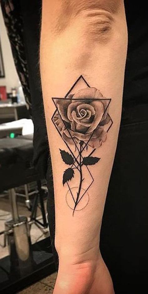 Detailed geometric rose tattoo on forearm, blending realistic floral and abstract shapes in black and grey ink.