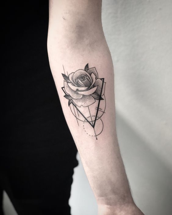 Geometric rose tattoo on a forearm, featuring intricate line patterns and shading for a modern artistic design.