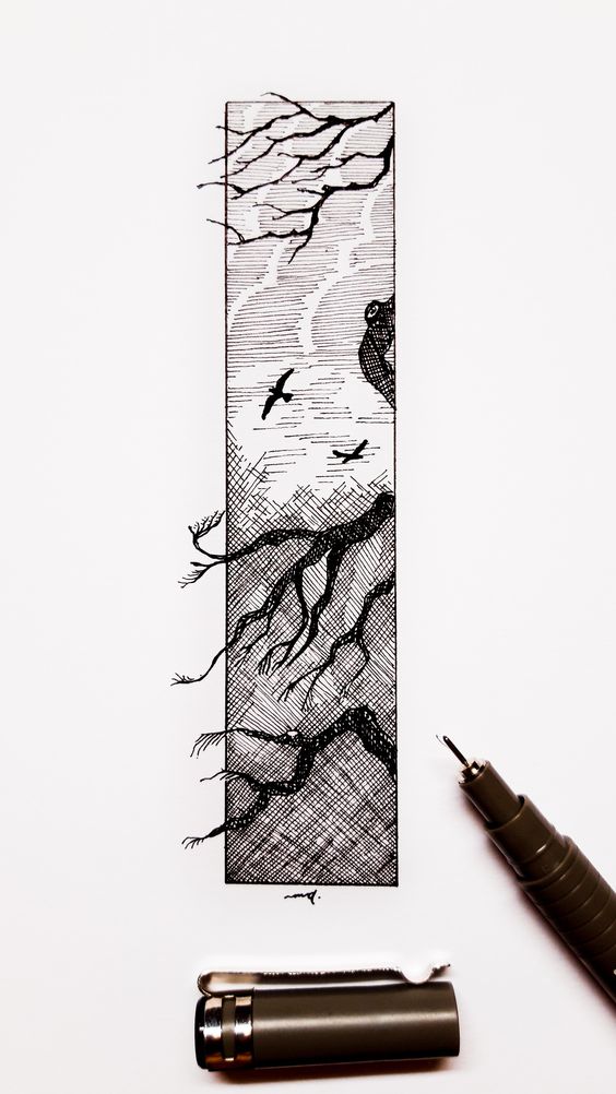 Intricate black ink landscape drawing with birds on a branch, beside an open black pen and a pen cap on a white background.