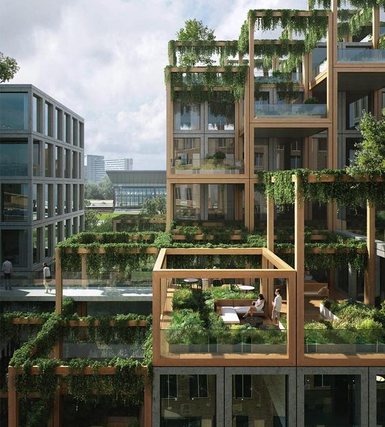 Modern building with lush green terraces, sustainable architecture featuring vertical gardens and open spaces for relaxation.