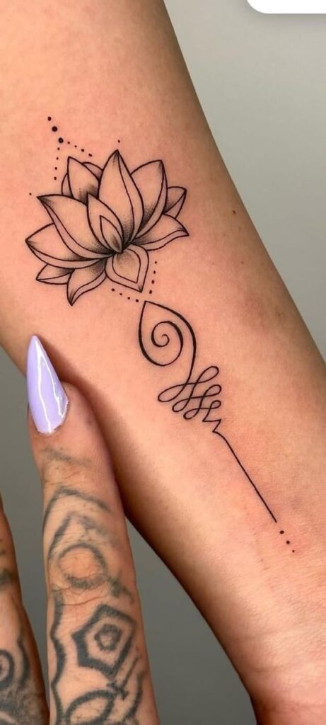 Minimalist lotus flower tattoo on forearm with fine lines and geometric details, delicate design for floral body art.