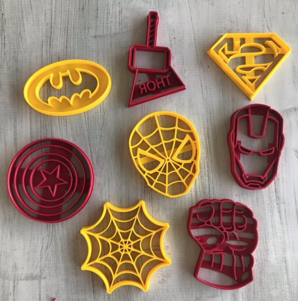 Superhero-themed cookie cutters featuring Batman, Thor, Superman, Captain America, Spider-Man, Iron Man, and Hulk designs.