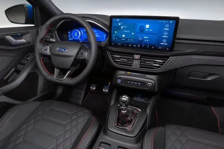 Interior view of a modern car with advanced dashboard, touchscreen display, and manual gear shift in the central console.