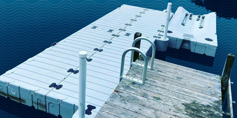 Floating dock with a swim platform and swim ladder, perfect for boating and water activities on a sunny day.