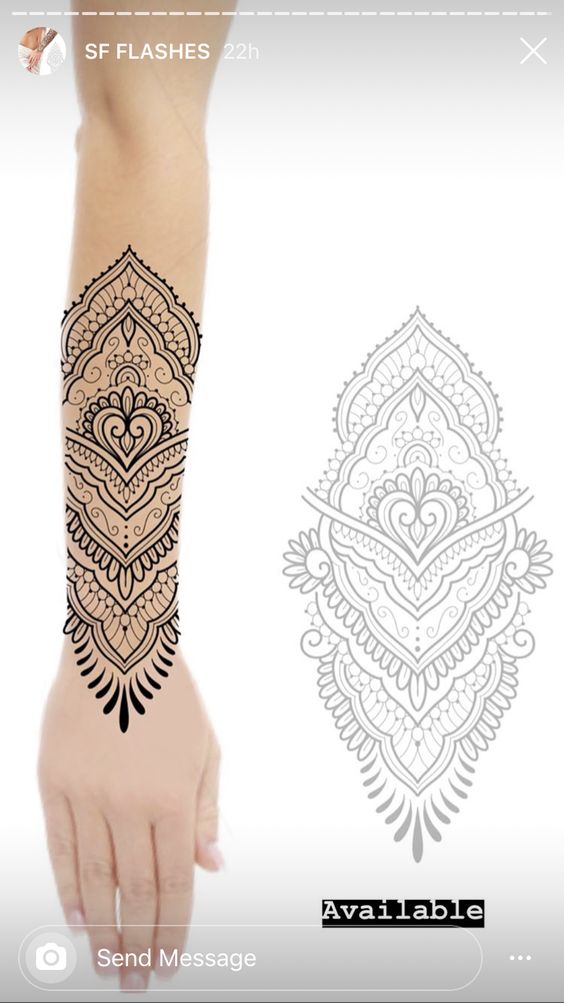 Ornate black and white henna design tattoo on forearm with intricate patterns, available now.