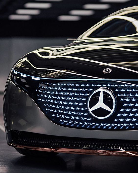 Close-up of futuristic Mercedes-Benz concept car showcasing the illuminated front grille with the iconic star logo.