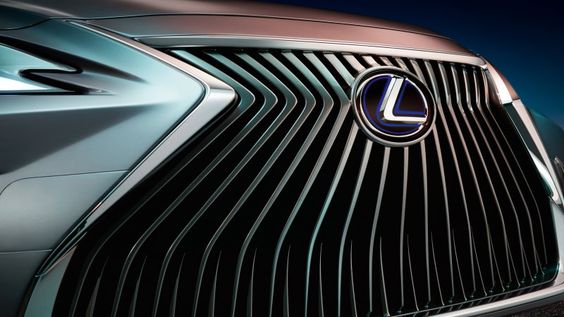 Close-up of a Lexus car grille featuring the iconic Lexus logo, showcasing luxury automotive design and elegance in detail.