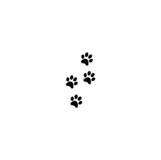 Black paw prints on white background, representing pet footprints, ideal for animal-themed designs and pet products.