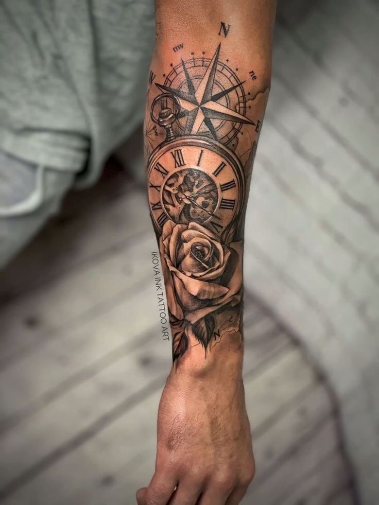 Forearm tattoo with compass, clock, and rose design, showcasing intricate detail and realistic shading.