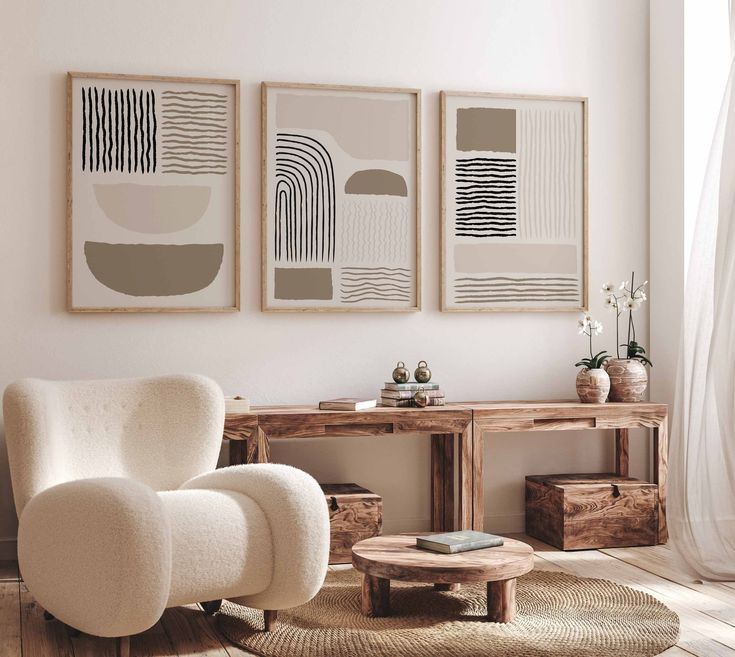 Minimalist living room featuring abstract art, wooden furniture, cozy white armchair, and natural sunlight. Modern interior design.