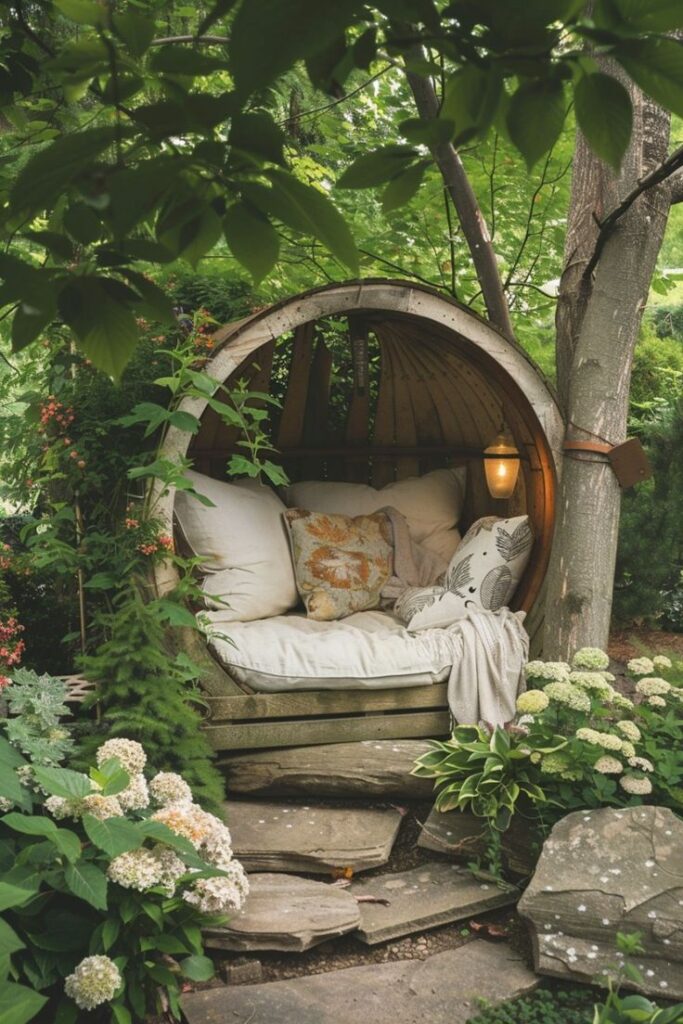 Cozy garden nook with a round wooden seat, pillows, and a blanket surrounded by lush greenery and flowers. Retreat and relax.