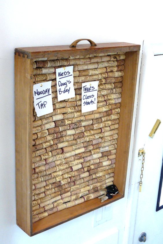 Handmade corkboard with notes and keys for reminders, displaying Monday tip, Doug's birthday, and Thursday class starts.