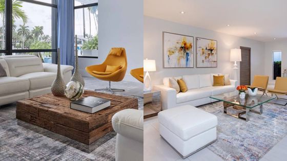 Modern living room interior with white sofas, yellow chairs, rustic coffee tables, large windows, and colorful decor.