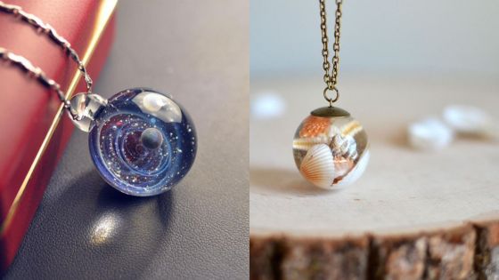 Unique glass necklaces featuring a celestial design and a seashell encased pendant, showcasing intricate craftsmanship.