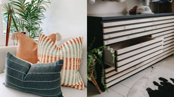 Cozy living space featuring patterned throw pillows on a sofa and a modern striped dresser with an open drawer and plant accents.