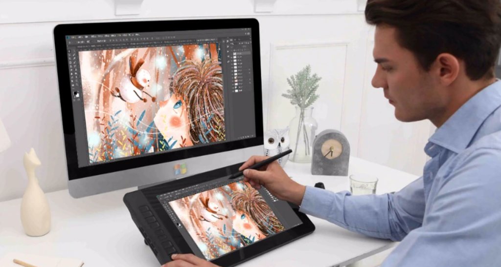 Graphic designer working on digital artwork using a pen tablet and desktop monitor in a home office environment.