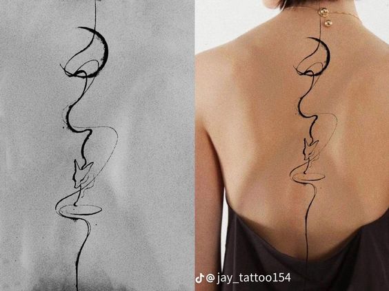 Minimalist abstract back tattoo featuring a face, bird, and symbolic design by @jay_tattoo154 on TikTok.