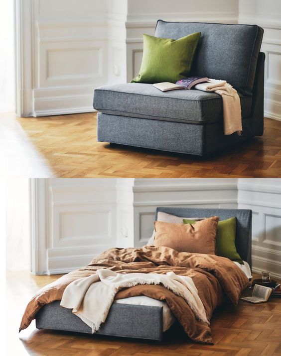 Multifunctional gray chair that converts into a cozy bed, featuring green and brown pillows, ideal for small spaces.