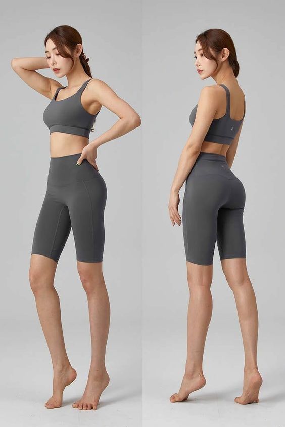 Woman in grey sportswear, showing front and back view of workout apparel. Ideal for gym, yoga, and fitness activities.