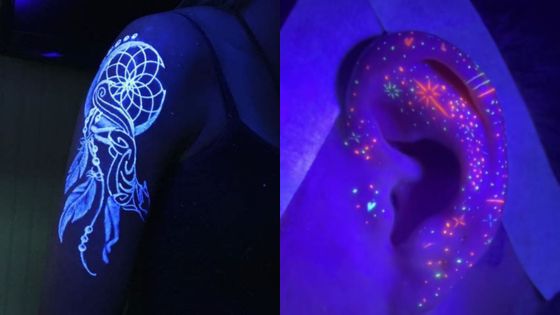 UV tattoos on shoulder and ear under blacklight, featuring glowing dreamcatcher design and colorful dots, showcasing body art.