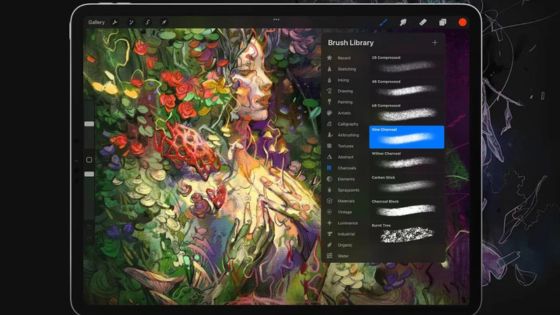 Digital tablet showing an intricate floral artwork and a brush library menu, illustrating a digital painting in progress.