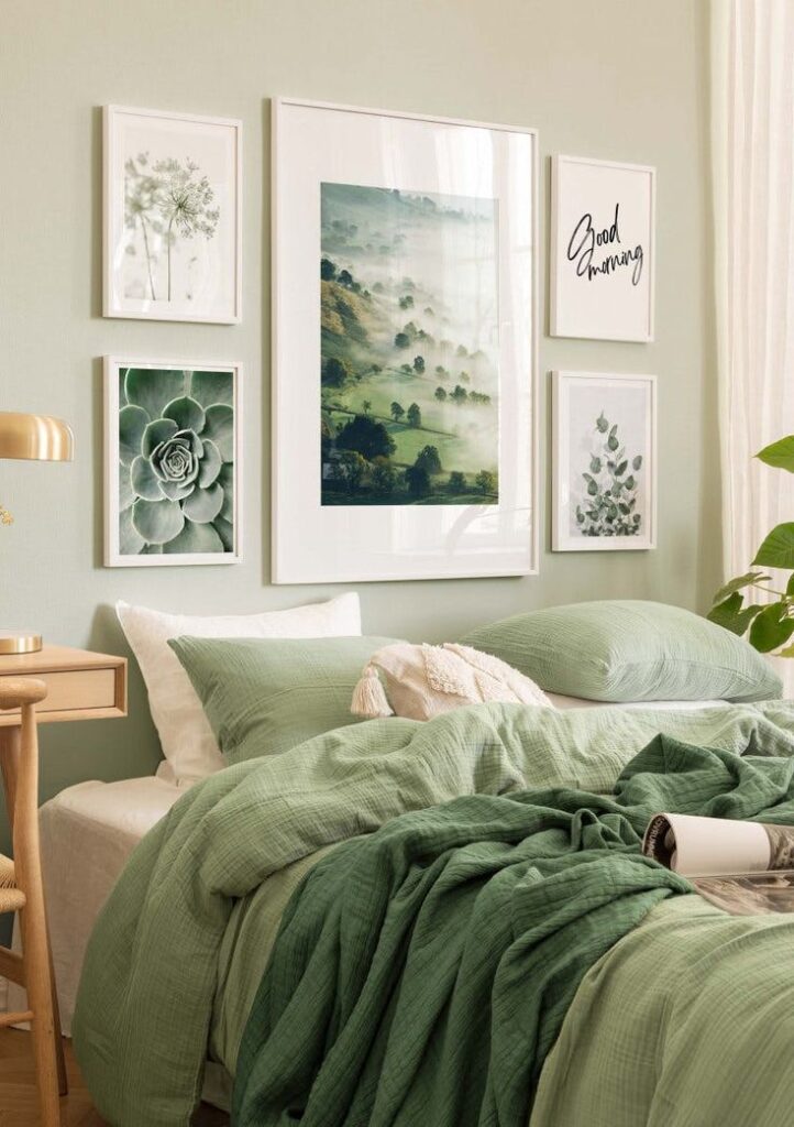 Cozy bedroom with green bedding, nature-themed wall art, and wooden side table for a calming and stylish home decor.