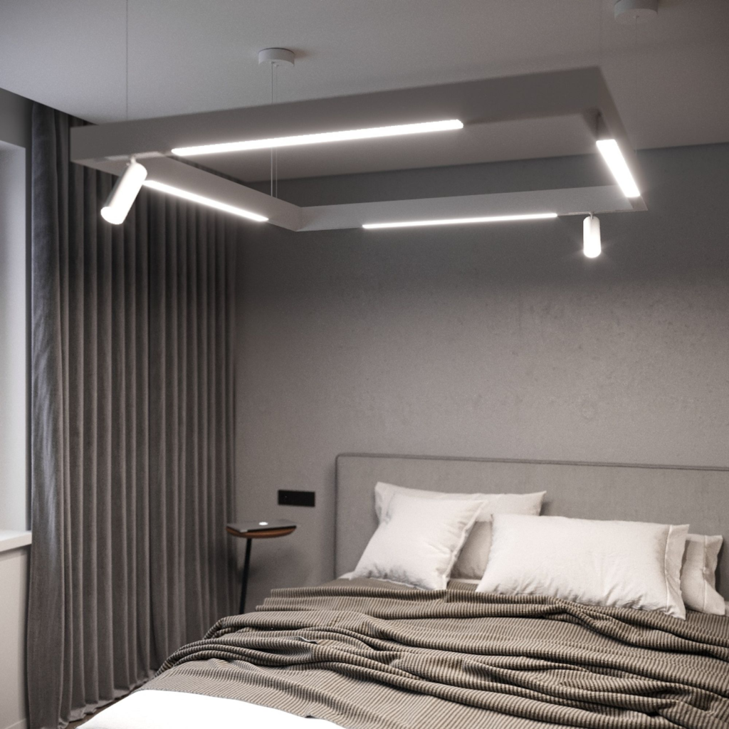 Modern bedroom with minimalist decor, featuring a contemporary hanging light fixture, grey drapes, and a cozy bed.