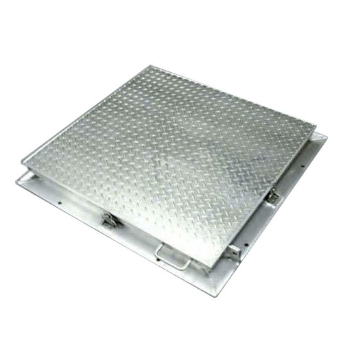 Metal access panel with diamond plate design, ideal for floor or wall installations. Durable and secure construction.