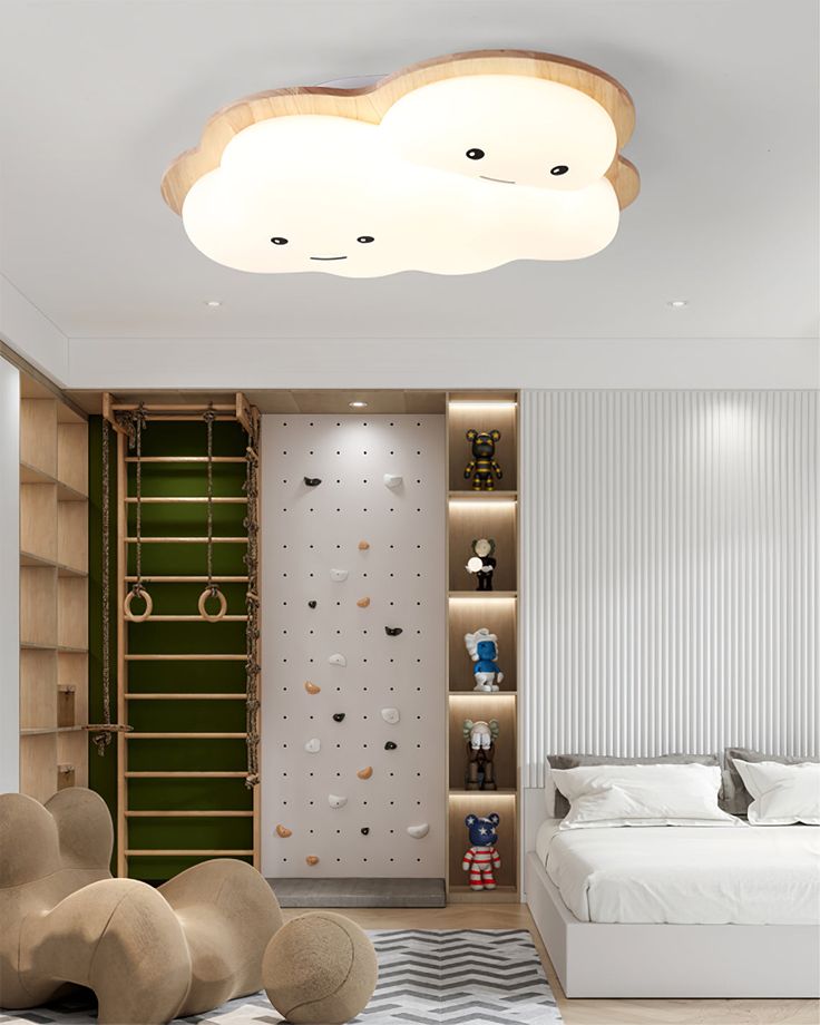 Children's room with cloud ceiling light, climbing wall, plush toy shelves, and modern decor.