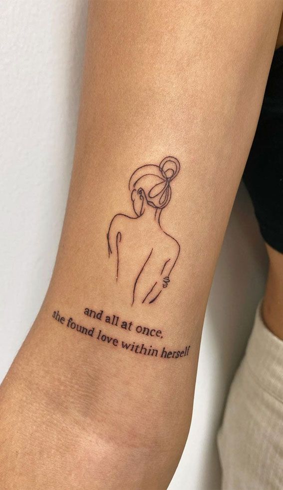 Minimalist tattoo of a woman with text and all at once, she found love within herself on arm.